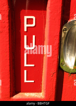 pull handle on telephone box Stock Photo