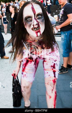 Staring woman dressed up as a zombie at Sergels Torg during horror masquerade event Zombie Walk Stockholm in May 2009 Stock Photo