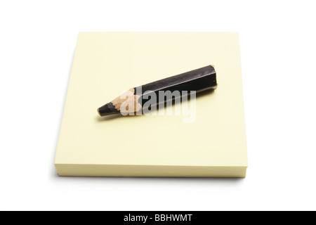 Black Pencil and Post It Note Pad Stock Photo