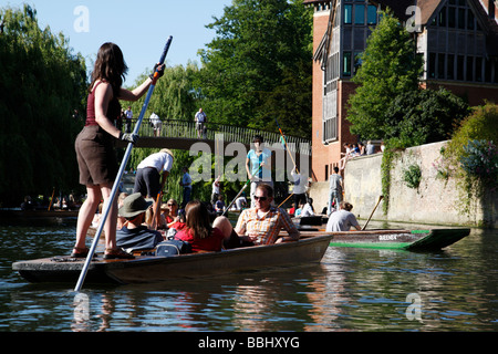 female punting on the river cam in an area known as the backs cambridge uk Stock Photo