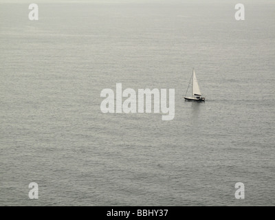 sailing dinghy in a calm sea Stock Photo