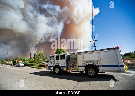 Santa Barbara, California - Fire engine drives along Foothill rd with smoke filled sky during jesusita fire, Wed, May 6 2009 Stock Photo