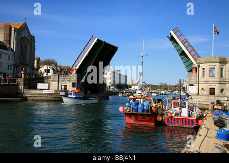 The Weymouth Town Bridge open to allow boats through of the inner harbour and marina Stock Photo