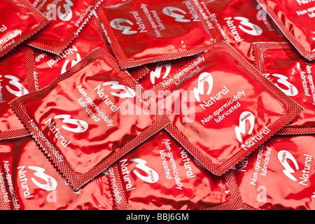 Condoms in red foil packets close up Stock Photo
