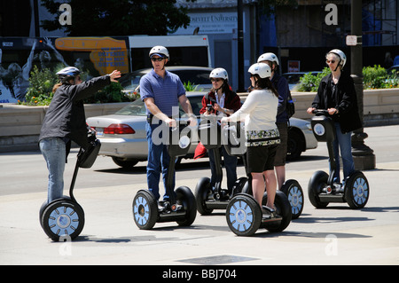 Segway riders on Michigan Avenue Chicago Illinois USA Tour group exploring this american city Stock Photo