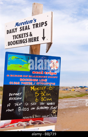 Signs advertising seal trips at Blakeney Point in Blakeney North Norfolk Uk Stock Photo