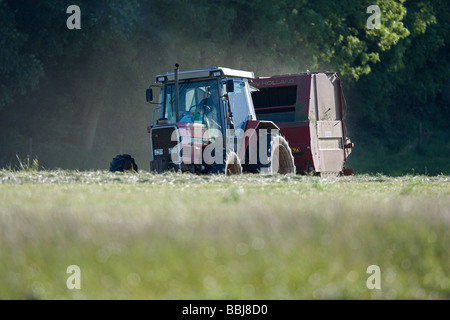 Tractor Baling Silage Stock Photo