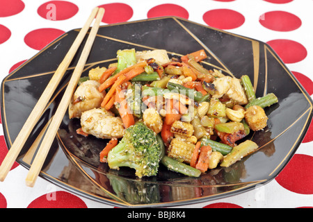Chinese meal of chicken cashew nuts and stir fried vegetables Stock Photo