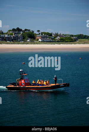 Excursion tour boat heading out of North Berwick harbour, East Lothian, Scotland, UK, Europe Stock Photo