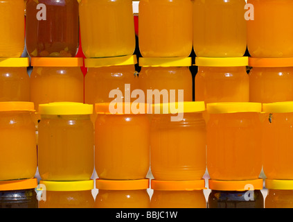 a lot of jars with assorted honey Stock Photo