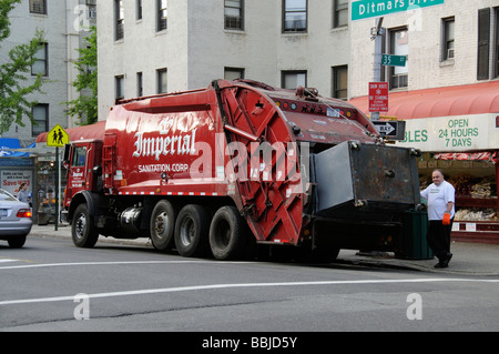 Commercial waste garbage collection truck on Ditmars Blvd Astoria New York USA Stock Photo