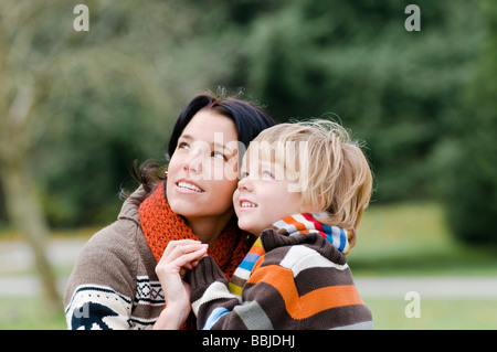 Young woman and boy looking upward, Vancouver, British Columbia Stock Photo