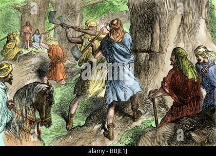 Solomon's servants hewing the cedars of Lebanon to build the Hebrew temple in Jerusalem. Hand-colored woodcut Stock Photo