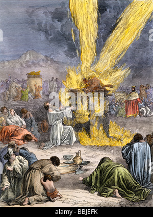 Prophet Elijah invoking Yahweh over Baals priests on Mount Carmel. Hand-colored woodcut Stock Photo