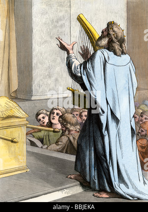 King David playing the harp in ancient Israel. Hand-colored woodcut Stock Photo