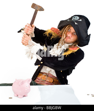a pirate aming a hammer at a piggybank isolated on white Stock Photo