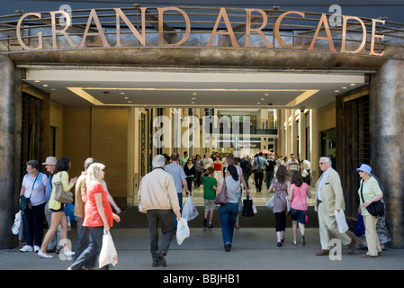 Crowds of shoppers on a sunny day entering the Grand Arcade shopping mall,  Cambridge, UK Stock Photo