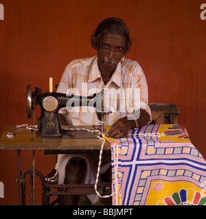 Man using a sewing machine in India Stock Photo