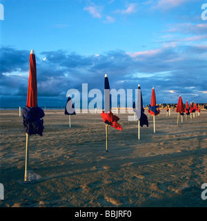 Folded parasols on the Deauville beach in Normandie. France. Stock Photo