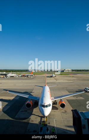 EasyJet aircraft on the stand on a clear sunny day at Gatwick Airport, London Stock Photo