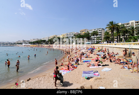 The main beach on the Croisette, in the centre of Cannes, French riviera, during the famous film festival. Southern France. Stock Photo