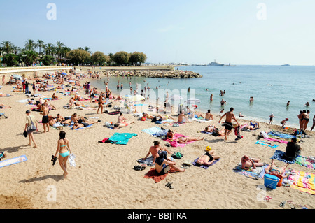 The main beach on the Croisette, in the centre of Cannes, French riviera, during the famous film festival. Southern France. Stock Photo