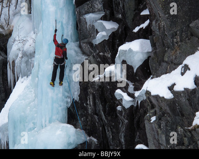 A climber on Topp (WI5) during a ice climbing festival at the Krokan area of Rjukan, Norway Stock Photo