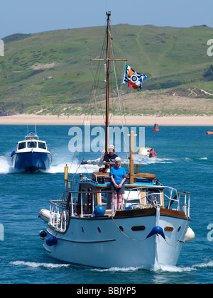 Grey haired couple on a boat in the Camel Estuary heading for padstow harbour Stock Photo