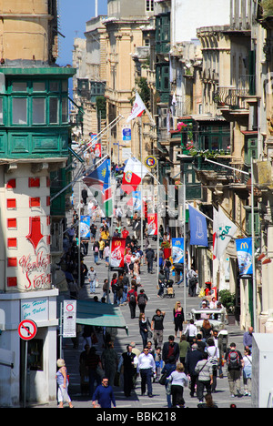 VALLETTA, MALTA. Shoppers and tourists on Triq ir-Repubblika (Republic Street), as seen from the main city gate. 2009. Stock Photo
