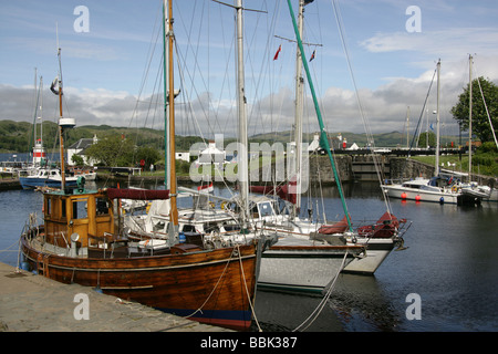 Crinan Canal, Scotland. Leisure and fishing boats berthed in Crinan Harbour with the fishing vessel Scarbh in the foreground. Stock Photo