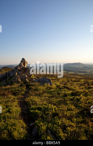 Path to rocky outcrop on the Stiperstones, Shropshire, looking towards Corndon HIll in Wales Stock Photo