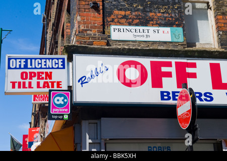 Brick Lane , Shoreditch , East End , corner Princelet Street , misspelled sign ' Rabbi's ' off licence - should be ' Rabi's ' !!