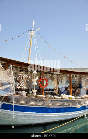 Souvenir stall on fishing boat, Kolona Harbour, Old Town, City of Rhodes, Rhodes, Dodecanese, Greece Stock Photo