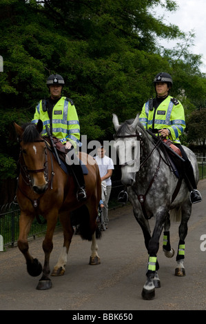 Mounted Metropolitan Police officers on patrol on horseback in London, England. Stock Photo