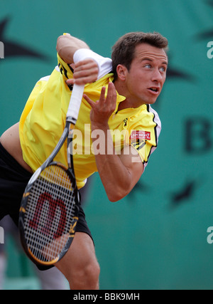 Tennis player Philipp Kohlschreiber playing a service at Roland Garros