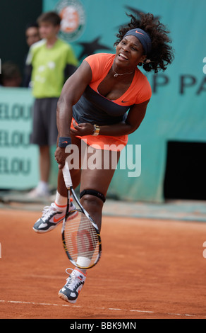 Tennis player Serena Williams plays a service at Roland Garros Stock Photo