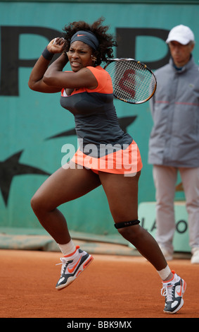 Tennis player Serena Williams plays a backhand return at Roland Garros Stock Photo