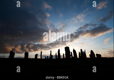 Callanish standing stones, Isle of Lewis, Outer Hebrides, Scotland Stormy sunset silhouette Stock Photo