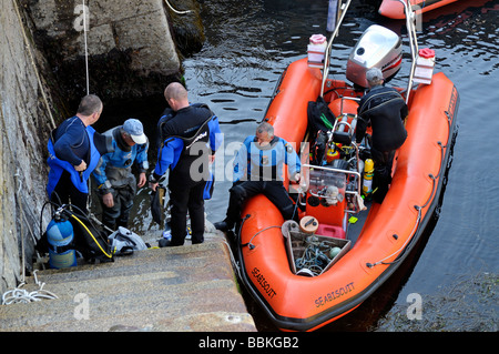Scuba divers loading RIB dive boat Fort Bovisand harbour Plymouth Devon England Stock Photo