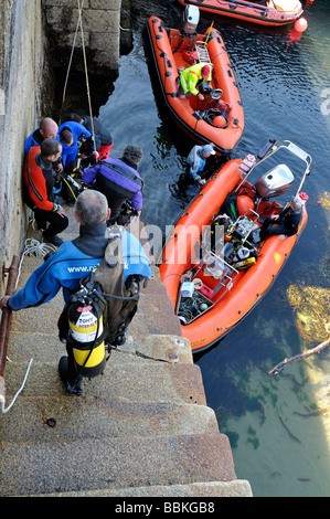 Scuba divers loading RIB dive boat Fort Bovisand harbour Plymouth Devon England Stock Photo