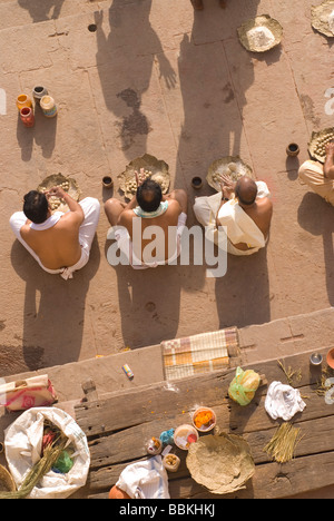 Hindu holy men performing religious ceremony puja Varanasi India Stock ...