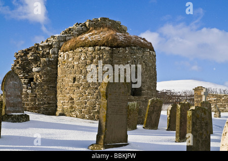 dh St Nicholas Church ORPHIR ORKNEY Round Kirk nave ruin and gravestone in snow Stock Photo
