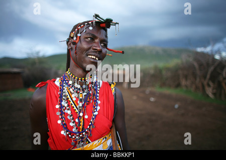 Ngoiroro is a village of 200 inhabitants all belonging to the Massai Tribe The village lays right in the rift valley south of Nairobi against the tanzanian border The Massai live very close to nature and their animals The cows and goats are more important then money to the massai Each family owns around 50 cows and 50 goats The main diet of the villagers is meat and milk The women are suppose to milk the cows twice a day and the small boys have to look after the herd during the day while grazing Stock Photo