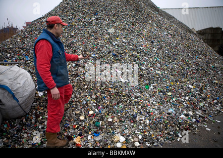 Recycling of bottle caps All municipalities in The Netherlands are required to provide known collection points for recyclable and or hazardous materials All types of separated trash can be accepted here for free or a small sum depending on type of material green stuff and concrete bricks is usually free Some stores perform collection of chemicals paint batteries Dutch household waste recycling averages to 60 2006 Stock Photo