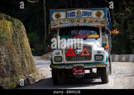 Colourful lorry transporting goods. Tata Bhutan Asia. Decorated in bright colours. Horizontal 91532 Bhutan Stock Photo