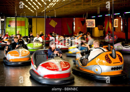 Driving bumper cars in Bakken amusement park, Copenhagen, Denmark Stock Photo