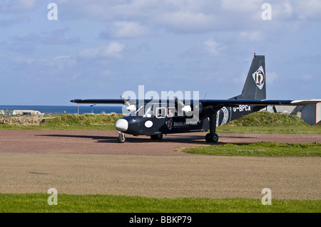 dh  NORTH RONALDSAY ORKNEY Loganair Britten Norman Islander airplane taxiing on airfield runway plane