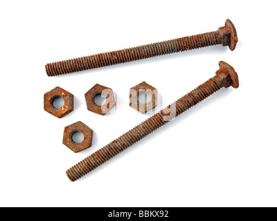 Two rusty bolts with four old nuts Stock Photo