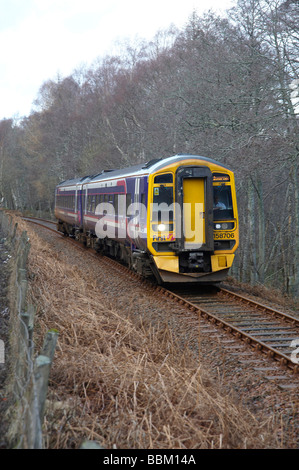 Local Scotrail train on the Inverness to Kyle of Lochalsh Line, Scottish Highlands, outside Garve Stock Photo