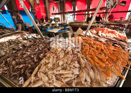 Seafood stall at the Peschería Rialto fish market San Polo Venice Italy Stock Photo